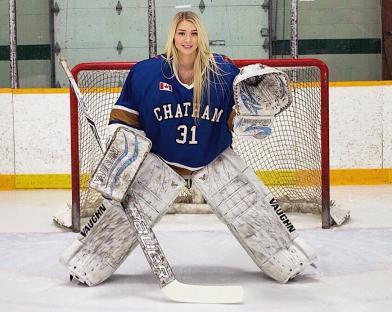 a hockey goalie with the number 31 on her jersey