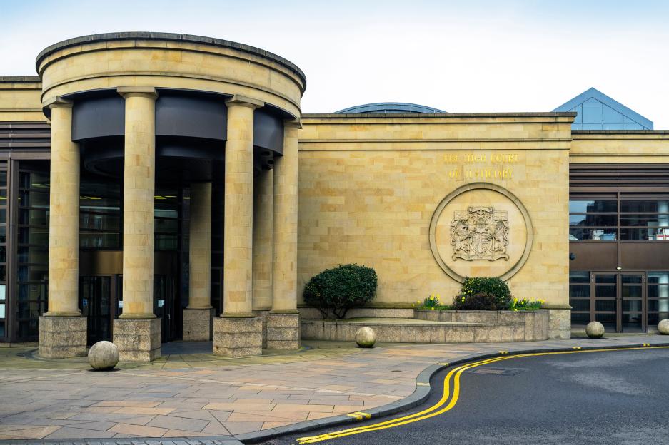 Front access doorway and wall with a Justiciary motif at the High Court of Justiciary in Glasgow, Scotland.