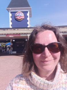 Woman wearing sunglasses at Alton Towers Resort.
