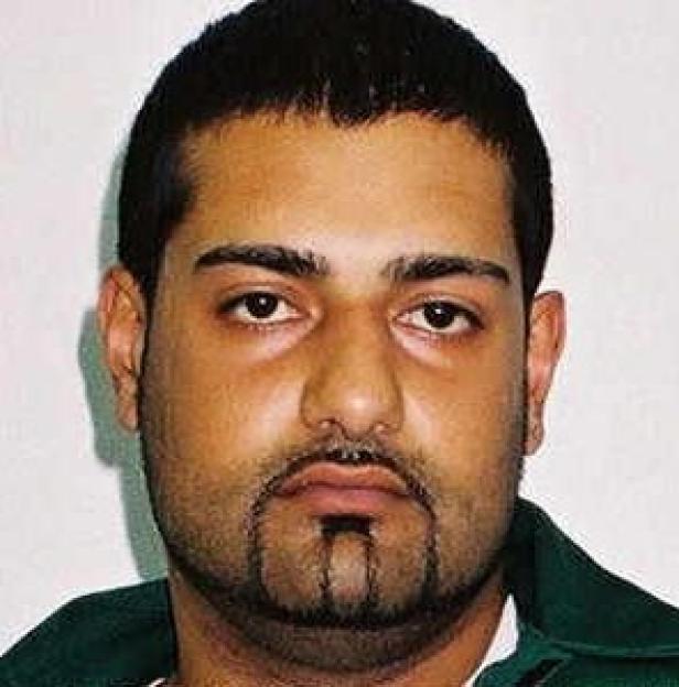 Mubarek Ali, a man with a short beard and mustache.