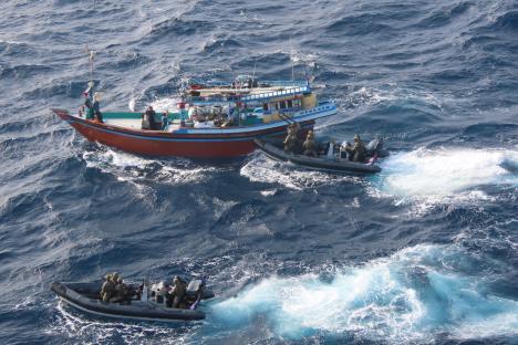 Elite Royal Marines pose with £30m worth of seized illegal drugs after storming smuggler’s dhow