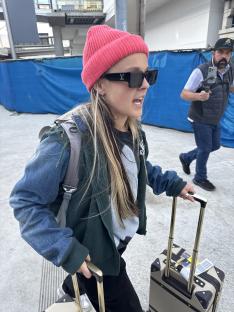 JoJo Siwa arriving at LAX with luggage.