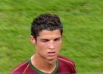 Cristiano Ronaldo winking during a soccer match.