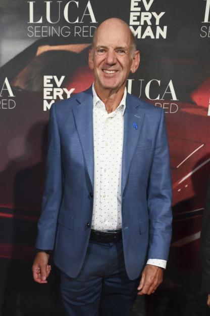 Adrian Newey smiling while attending the "Luca: Seeing Red" world premiere.