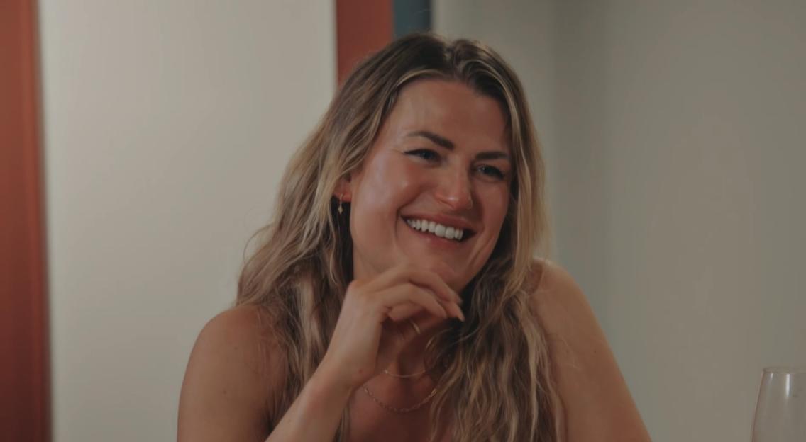 MAFS star Nelly laughs during an argument.