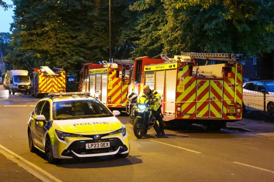 Resident seen ‘jumping from building’ as huge blaze ripped through flats with 70 firefighters called to tackle flames