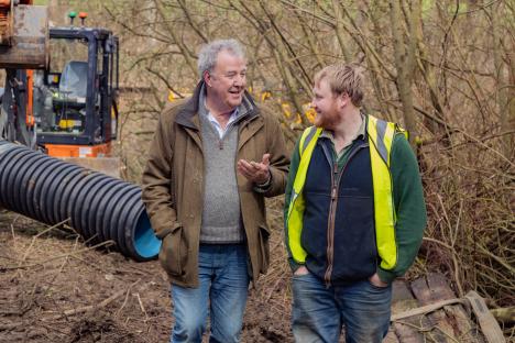 Jeremy Clarkson and Kaleb Cooper talking on a farm.