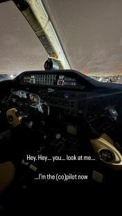 Photo of a private jet's cockpit at night, with text overlay reading,