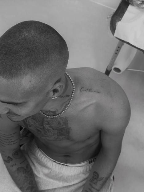 Romeo Beckham's new "C'est la vie" tattoo.