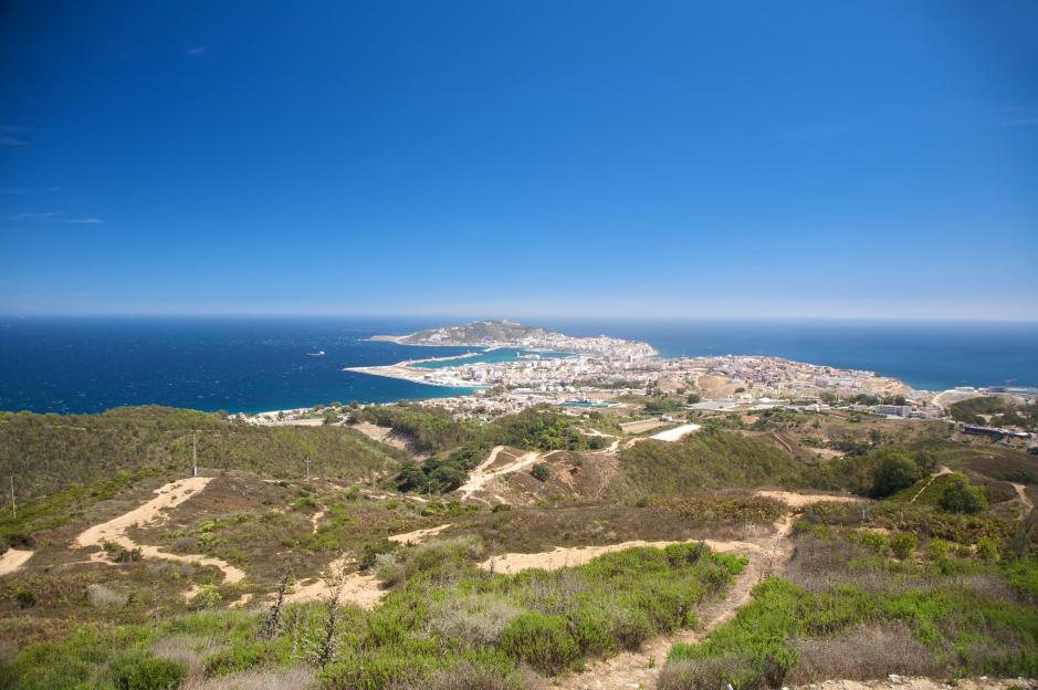 Aerial view of Ceuta, a Spanish town and port in Africa, with mountains in the foreground.