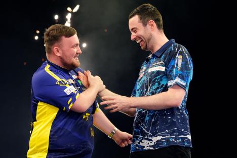 Luke Littler and Luke Humphries celebrating a darts victory.
