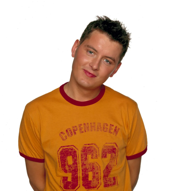 Portrait of a man wearing an orange t-shirt with "Copenhagen 962" on it.