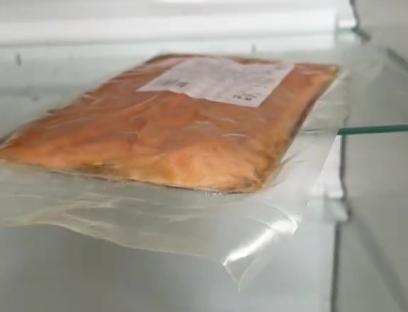 Packaged salmon in a refrigerator.