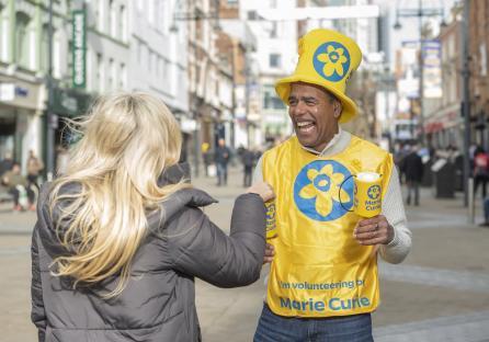 Chris Kamara, a football broadcaster and Marie Curie ambassador, volunteering for the Great Daffodil Appeal.