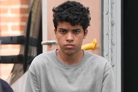 Teen who ‘murdered’ his dad, 57, in knife rampage that also left woman & 11-year-old boy injured is pictured in cuffs