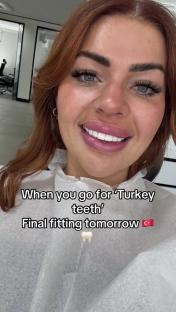 Woman smiling, showing off new teeth; text overlay says
