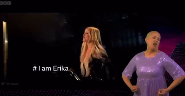 Two women lip-syncing to