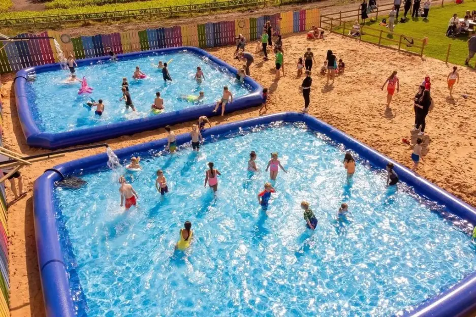 Giant new beach with 5 paddling pools, foam parties & over 250 tonnes of sand opens in landlocked UK village