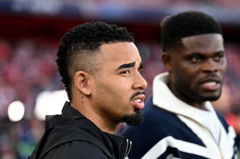 Gabriel Jesus of Arsenal, recovering from an injury, speaks with a teammate.