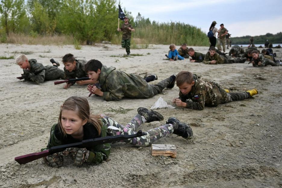 Chilling moment Russian kids crawl with AK-47s & throw grenades as Vladimir Putin prepares his next generation army
