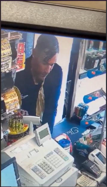 Security camera footage of a man stealing a Poppy Appeal charity box.