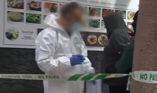 Crime scene with police and forensic investigators.