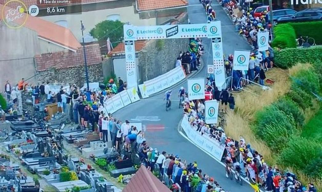 Tour de France fans slammed as 'disrespectful' after spectators spotted climbing on GRAVES to catch glimpse of the race