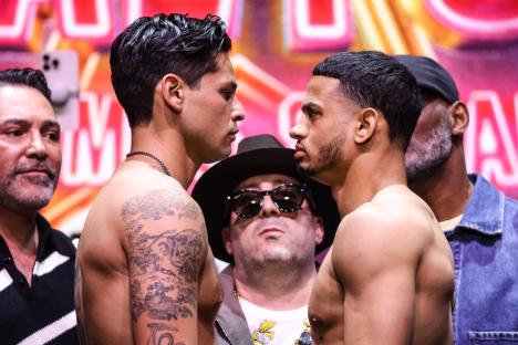 Ryan Garcia and Rolando Romero face off at a boxing weigh-in.