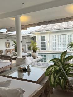 White villa with a pool.