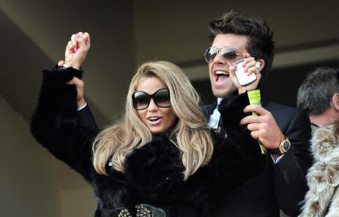 Katie Price and her boyfriend at the Cheltenham Racecourse.