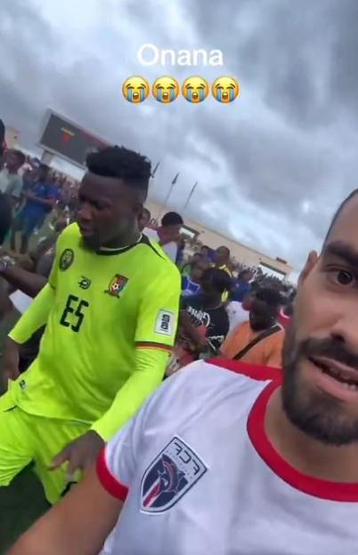 Moment ‘stressed’ Andre Onana shoves fan before bottle is thrown at him after Man Utd keeper’s Cameroon howler