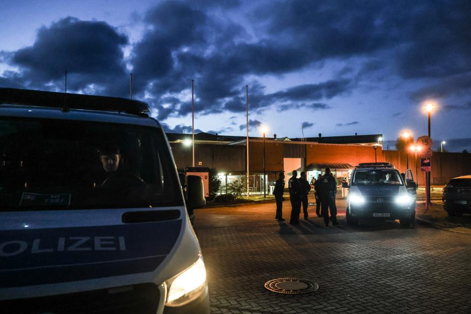Police officers stand next to a high-security prison in Sehnde, near Hanover, Germany.