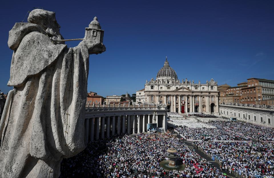 Large crowd at a canonization mass in St. Peter's Square.