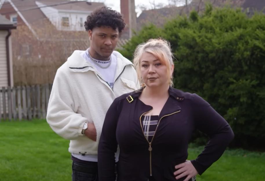 Tanya and Josue standing outside in a yard.