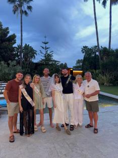 Group photo of a bride and her family and friends at a bridal shower.