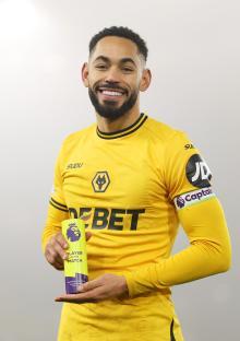 Matheus Cunha of Wolverhampton Wanderers holding the Player of the Match trophy.