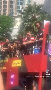 Soccer players on a bus.