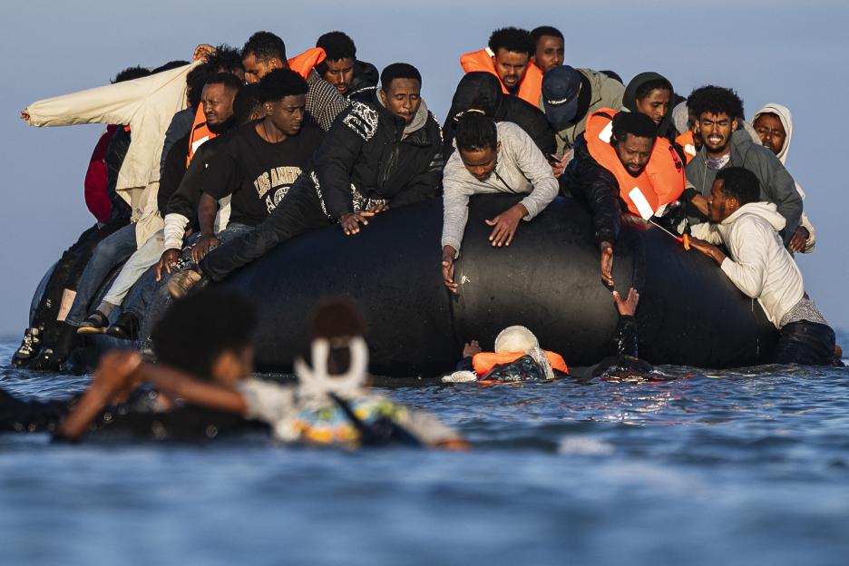 Migrants attempting to board smugglers' boats to cross the English Channel near Gravelines, northern France.