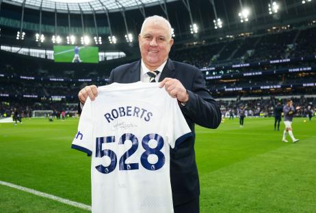 Graham Roberts holding his signed Tottenham Hotspur legacy shirt.