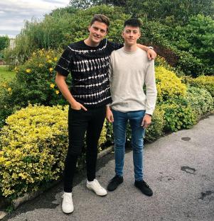 Dr. Alex George with his brother.