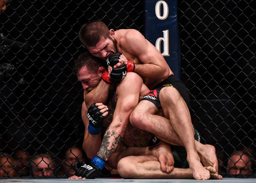 Khabib Nurmagomedov submitting Conor McGregor in a UFC fight.