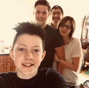 Family photo of four people.