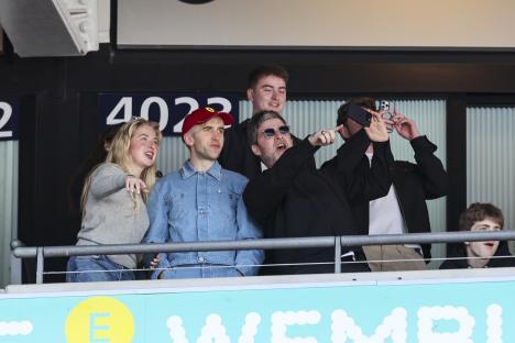 Noel Gallagher and family at a soccer match.