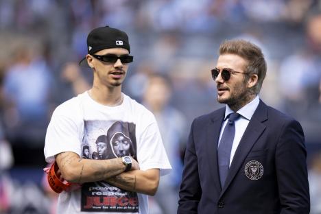 David Beckham and his son Romeo Beckham at a soccer match.