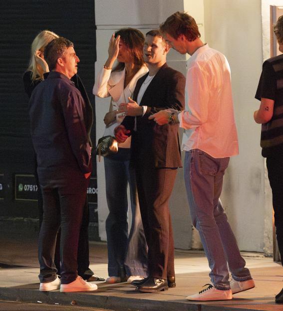 Noel Gallagher and Sally Mash at a pub with friends.