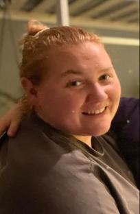 Woman smiling for a before-and-after weight loss photo.