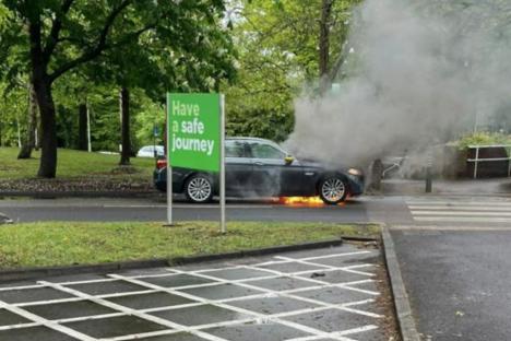 BMW bursts into flames at Asda car wash as firefighters tackle blaze