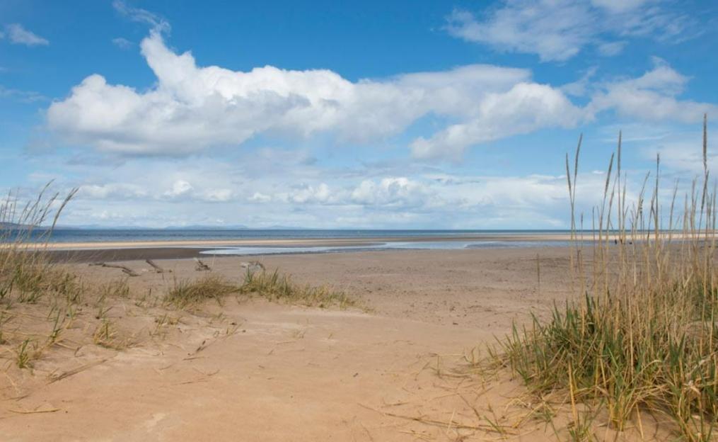 Sandy beach at Nairn Lochloy with sea and sky visible.