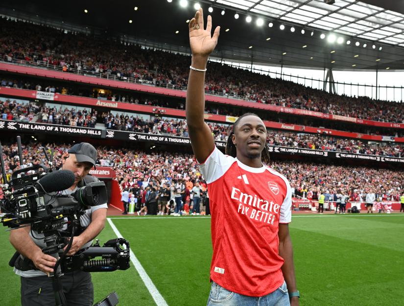 Eberechi Eze, new Arsenal signing, waves to fans at Emirates Stadium.