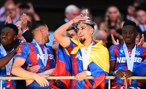 Crystal Palace player celebrates with the FA Cup trophy.